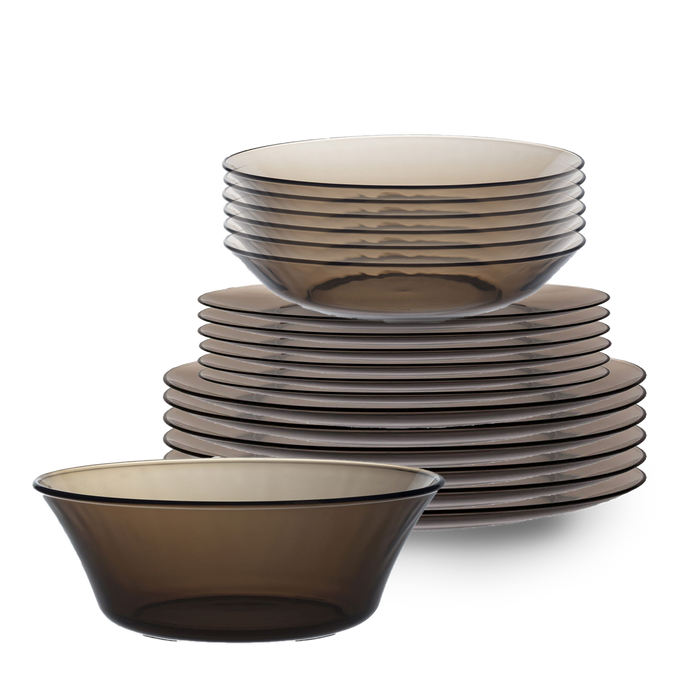 Duralex Lys. 19 Piece Dinnerware set, Six sepia glass dinner plates, six sepia glass dessert plates, six sepia glass soup bowls, and a sepia glass salad bowl. Ensemble de vaisselle de 19 pièces, six assiettes à dîner en verre sepia, six assiettes à dessert en verre sepia, six bols à soupe en verre sepia, et un bol à salade en verre sepia.
